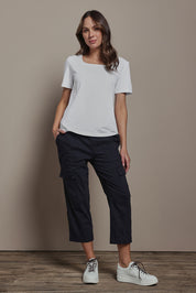 Model Madeline wearing size 10 of The Cotton Blend Cargo Pant in colour Navy (Blue), from the front, showing the whole outfit