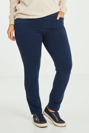 Model Laura wearing size 14 of The Leisure Pull On Pant in colour Navy (Blue), from the front, cropped image