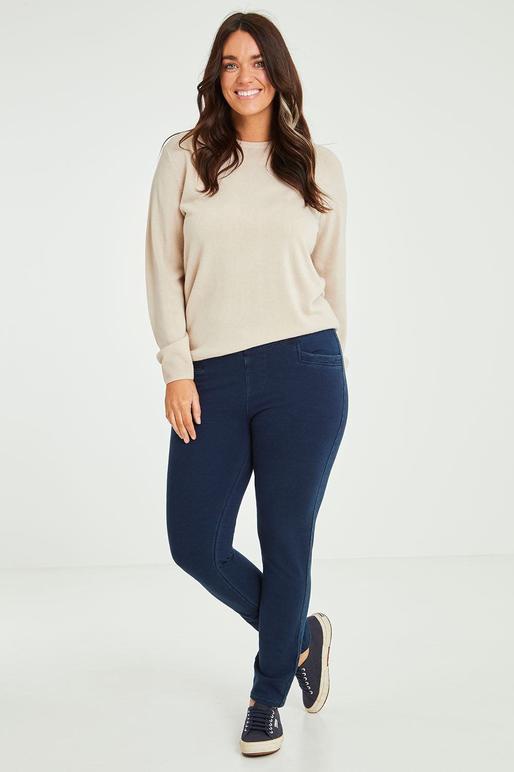 Model Laura wearing size 14 of The Leisure Pull On Pant in colour Navy (Blue), from the front, showing the whole outfit