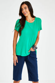 Model Vitoria wearing size 10 of The Bermuda Pull On Short in colour Denim (Blue), from the front, cropped image