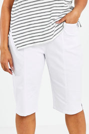 Model Sasha-Lee wearing size 16 of The Bermuda Pull On Short in colour White (White), from the front, cropped image