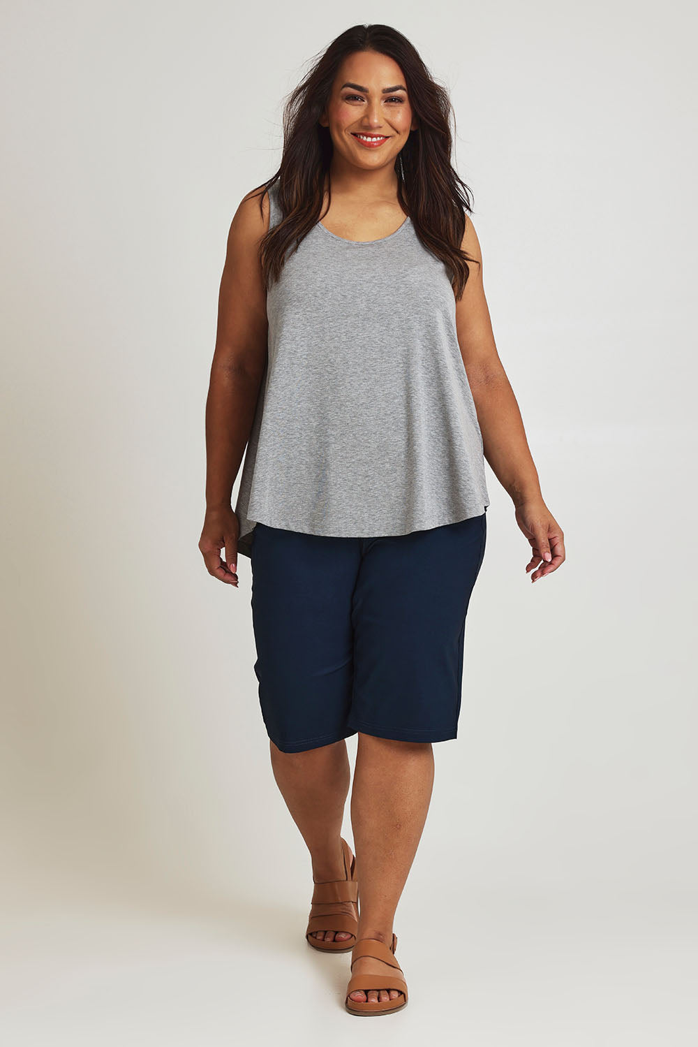 Model Ashleigh wearing size 16 of The Cargo Short in colour Petrol (Blue), from the front, showing the whole outfit