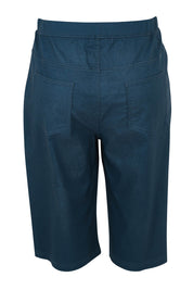 Product shot of The Cargo Short in colour Petrol (Blue), from the back