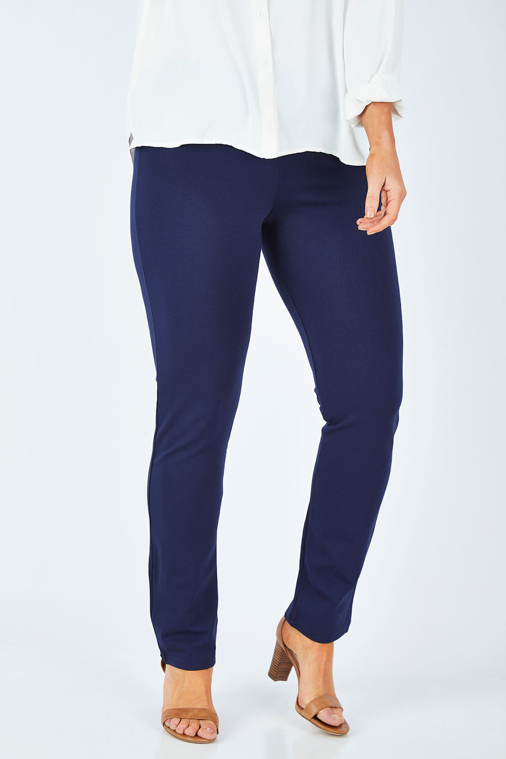 Model Laura wearing size 14 of The Straight Leg Ponte Pant in colour Navy (Blue), from the front, cropped image