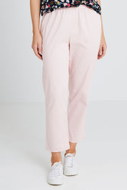 Model Andrea wearing size 10 of The Pull On Cotton Pant in colour Blushpink (Pink), from the front, cropped image