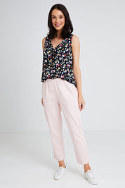 Model Andrea wearing size 10 of The Pull On Cotton Pant in colour Blushpink (Pink), from the front, showing the whole outfit