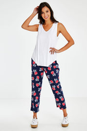 Model Vitoria wearing size 10 of The Printed Cotton Pull On Pant in colour Navyfloral (Blue), from the front, showing the whole outfit
