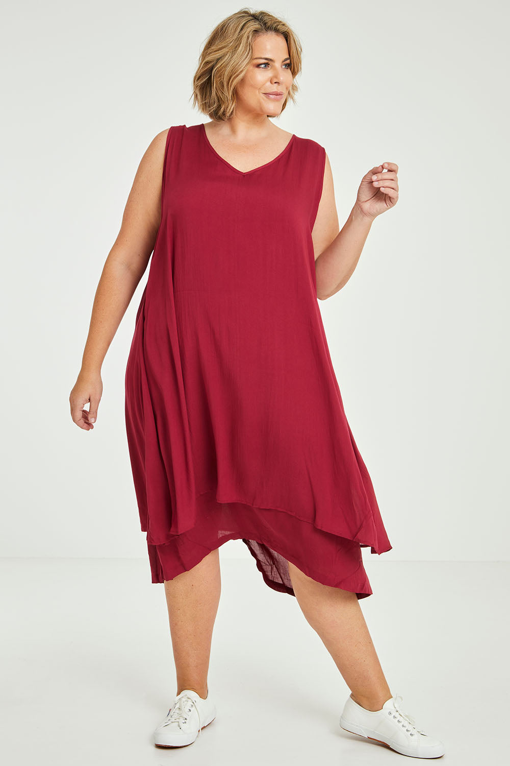 Model Fiona wearing size 16 of The Everyday Layered Dress in colour Cherryred (Red), from the front, showing the whole outfit