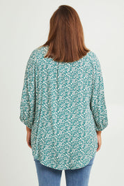 Model Monique wearing size 14 of The Perfect Relaxed Fit Shirt in colour Greenivory (Green), from the back