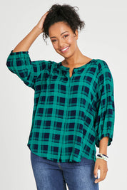 Model Noli wearing size 14 of The Perfect Relaxed Fit Shirt in colour Navycheck (Blue), from the front, cropped image