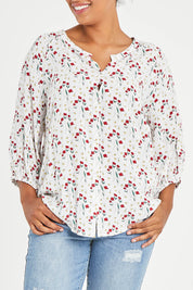 Model Noli wearing size 14 of The Perfect Relaxed Fit Shirt in colour Redfloral (White), from the front, cropped image