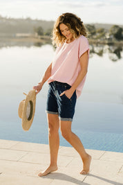 Model Emma wearing size 10 of The Weekender Shorts in colour Darkdenim (Blue), from the front, showing the whole outfit