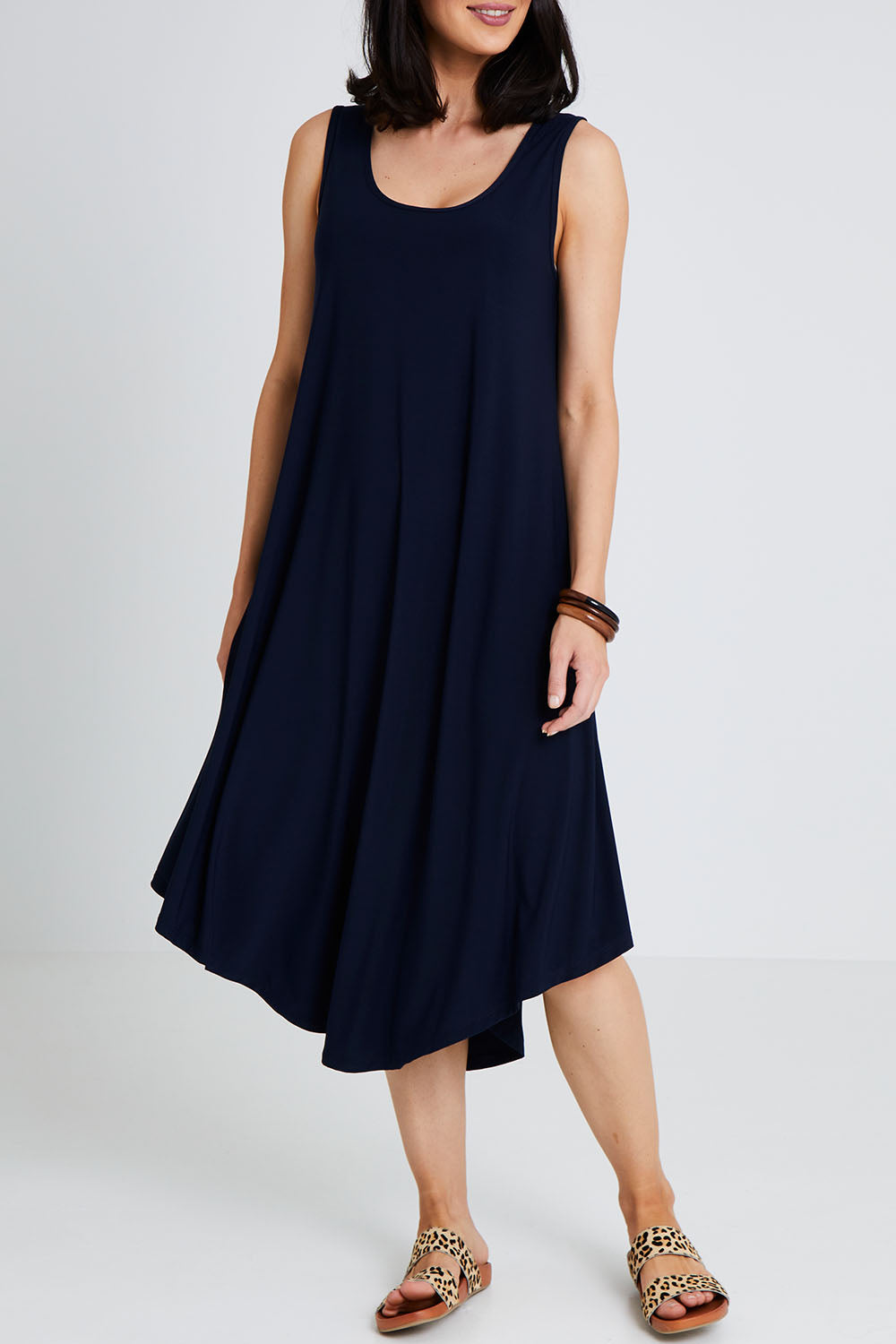 Model Andrea wearing size 10 of The Recycled High Low Dress in colour Navy (Blue), from the front, cropped image
