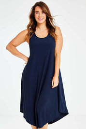Model Laura wearing size 14 of The Recycled High Low Dress in colour Navy (Blue), from the front, cropped image