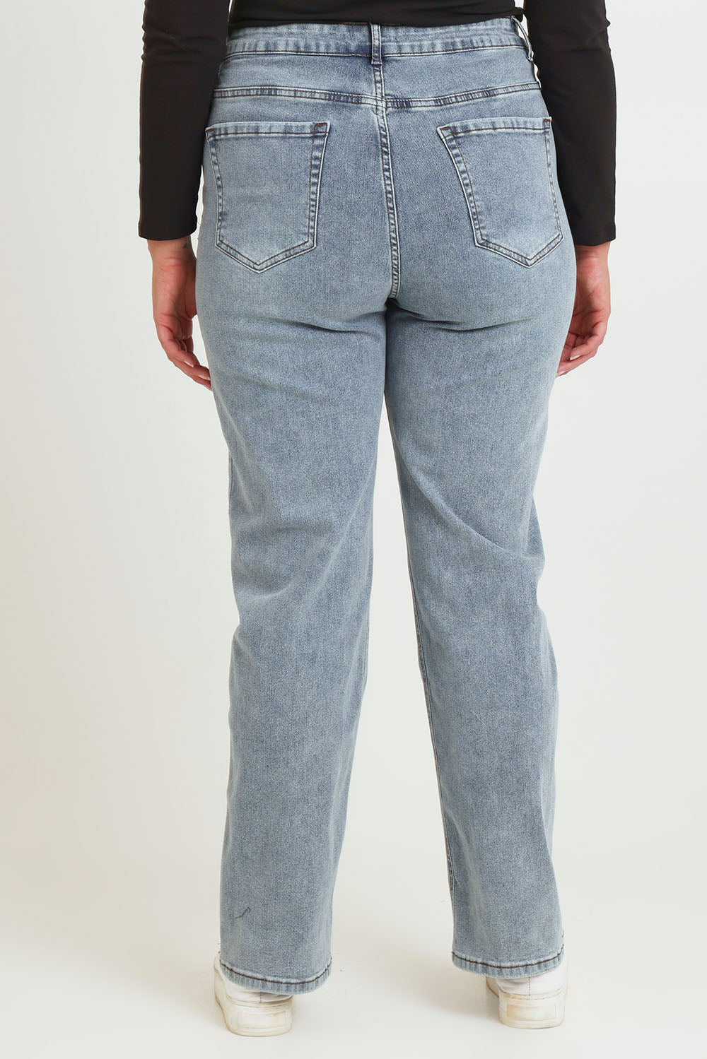 Model Chanel wearing size 16 of The Keepers Highwaisted Straight Jean in colour Lightdenim (Blue), from the back