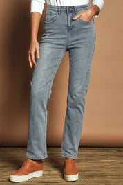 Model Madeline wearing size 10 of The Keepers Highwaisted Straight Jean in colour Lightdenim (Blue), from the front, cropped image