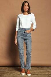 Model Madeline wearing size 10 of The Keepers Highwaisted Straight Jean in colour Lightdenim (Blue), from the front, showing the whole outfit