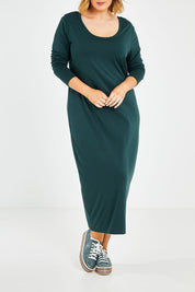 Model Jess wearing size 14 of The Long Sleeve Bamboo Dress in colour Forest (Green), from the front, showing the whole outfit