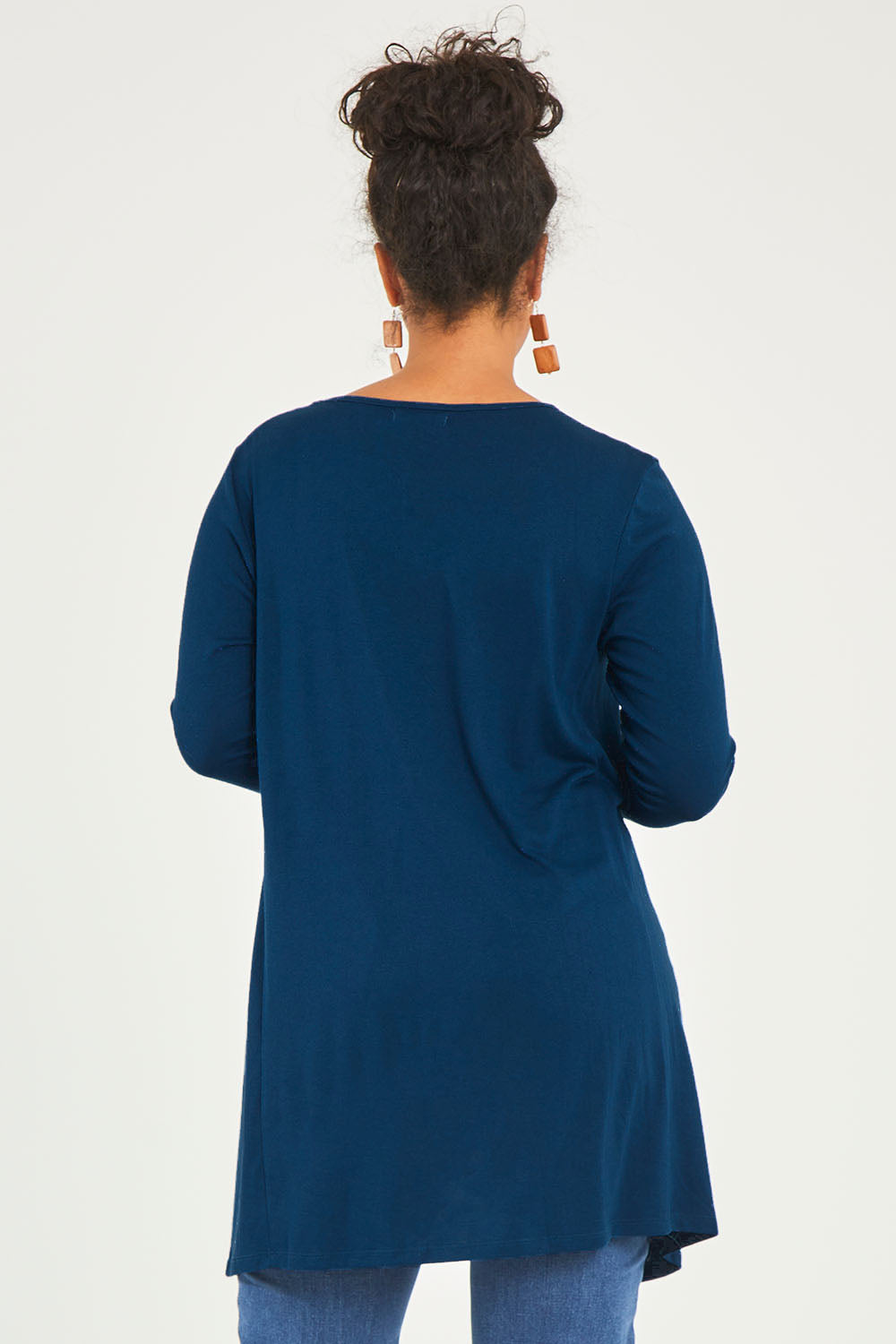 Model Noli wearing size 14 of The Crew Neck High Low Tunic in colour Deeplagoon (Blue), from the back