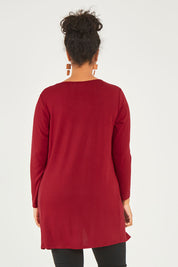 Model Noli wearing size 14 of The Crew Neck High Low Tunic in colour Redberry (Red), from the back