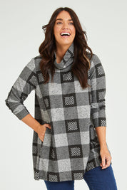 Model Laura wearing size 14 of The Woolly Knit High Low Tunic in colour Blackgrey (Black), from the front, cropped image