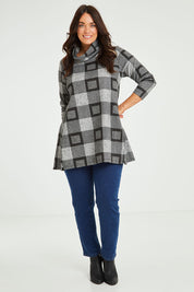 Model Laura wearing size 14 of The Woolly Knit High Low Tunic in colour Blackgrey (Black), from the front, showing the whole outfit