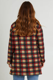 Model Laura wearing size 14 of The Woolly Knit High Low Tunic in colour Navycheck (Blue), from the back