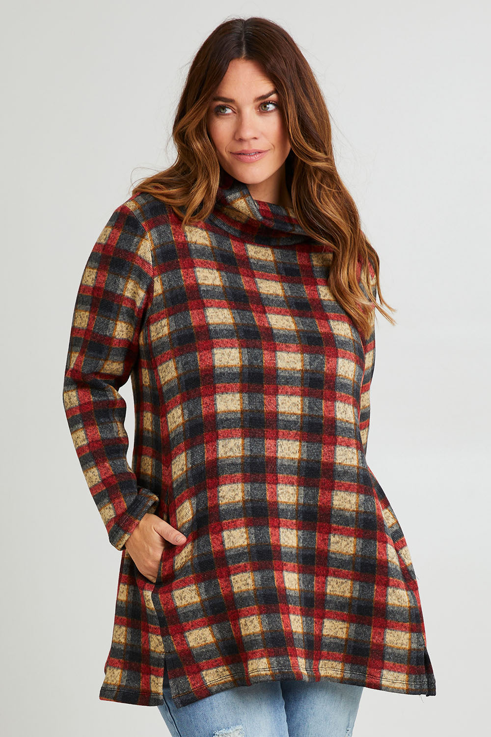 Model Laura wearing size 14 of The Woolly Knit High Low Tunic in colour Navycheck (Blue), from the front, cropped image