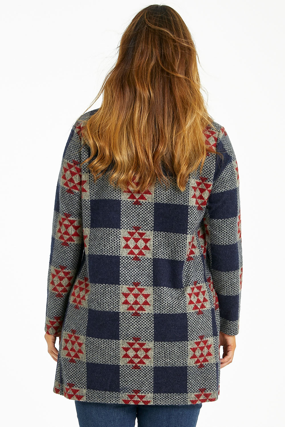 Model Laura wearing size 14 of The Woolly Knit High Low Tunic in colour Navyred (Blue), from the back