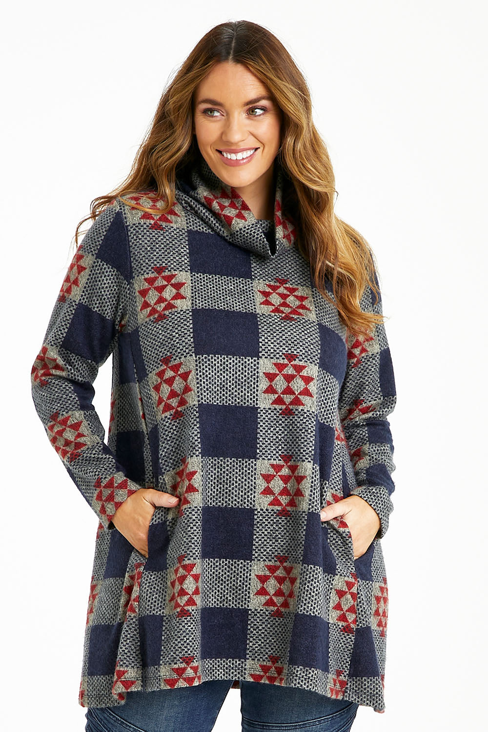 Model Laura wearing size 14 of The Woolly Knit High Low Tunic in colour Navyred (Blue), from the front, cropped image