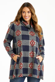 Model Laura wearing size 14 of The Woolly Knit High Low Tunic in colour Navyred (Blue), from the front, cropped image