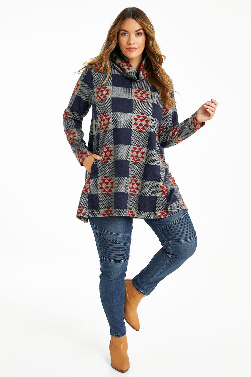 Model Laura wearing size 14 of The Woolly Knit High Low Tunic in colour Navyred (Blue), from the front, showing the whole outfit