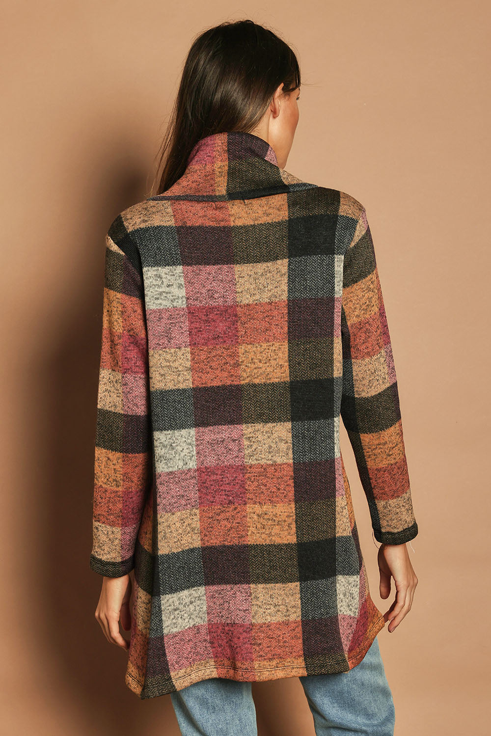 Model Madeline wearing size 10 of The Woolly Knit High Low Tunic in colour Pinkcheck (Pink), from the back