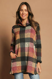 Model Madeline wearing size 10 of The Woolly Knit High Low Tunic in colour Pinkcheck (Pink), from the front, cropped image