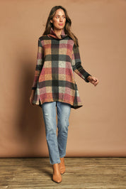 Model Madeline wearing size 10 of The Woolly Knit High Low Tunic in colour Pinkcheck (Pink), from the front, showing the whole outfit