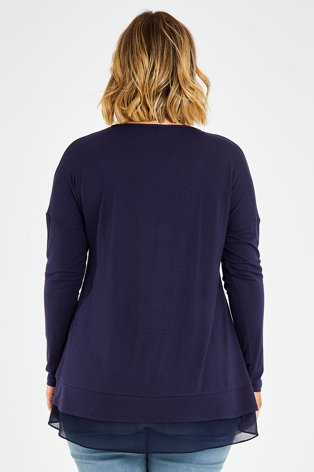 Model Jess wearing size 14 of The Chiffon Underlay Layered Tee in colour Darknavy (Blue), from the back