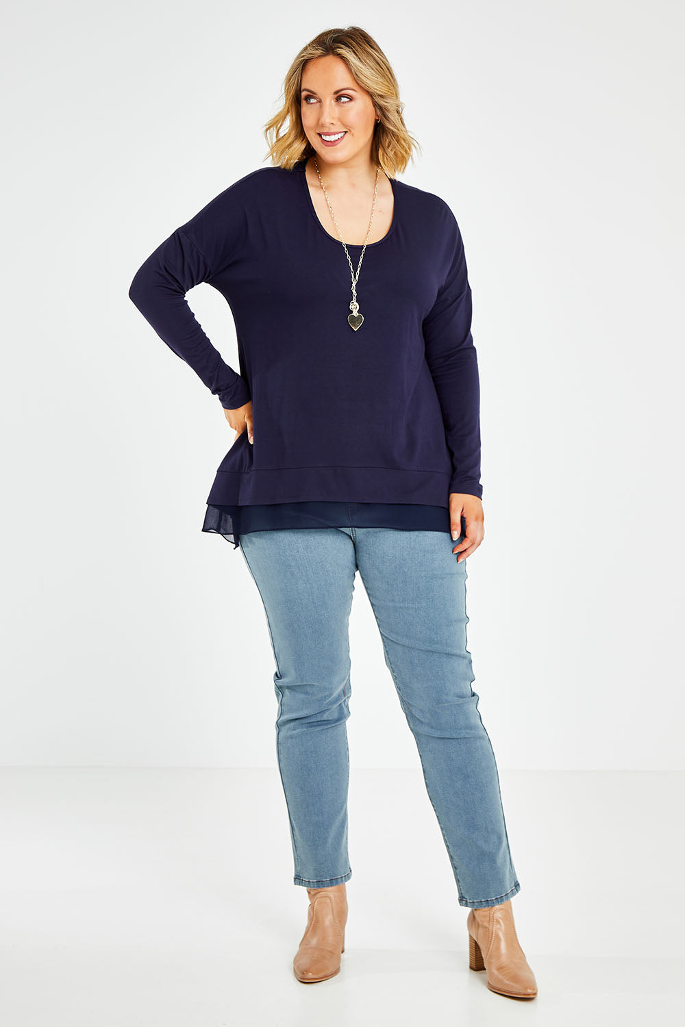 Model Jess wearing size 14 of The Chiffon Underlay Layered Tee in colour Darknavy (Blue), from the front, showing the whole outfit