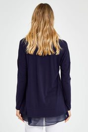 Model Kelly wearing size 10 of The Chiffon Underlay Layered Tee in colour Darknavy (Blue), from the back