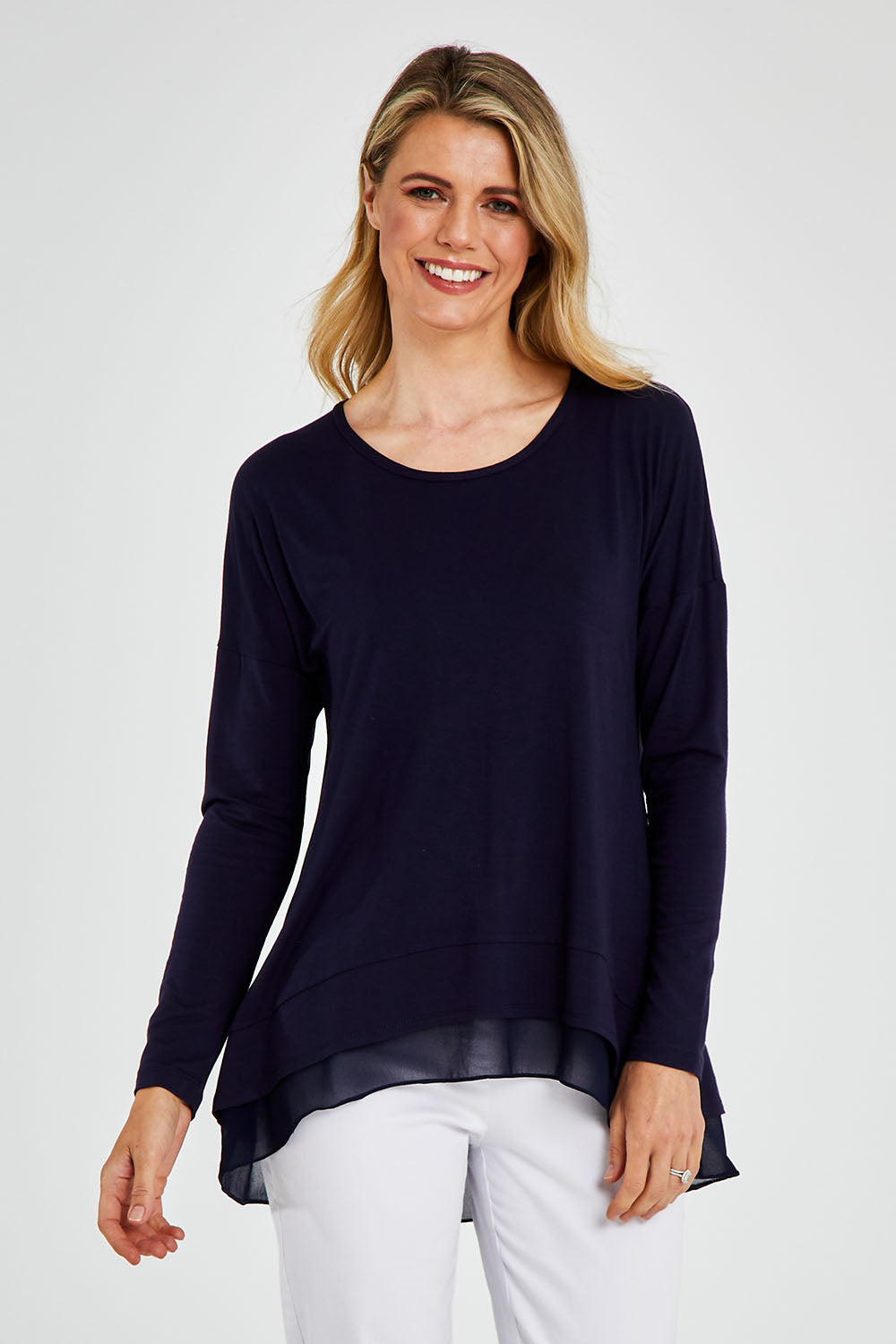 Model Kelly wearing size 10 of The Chiffon Underlay Layered Tee in colour Darknavy (Blue), from the front, cropped image