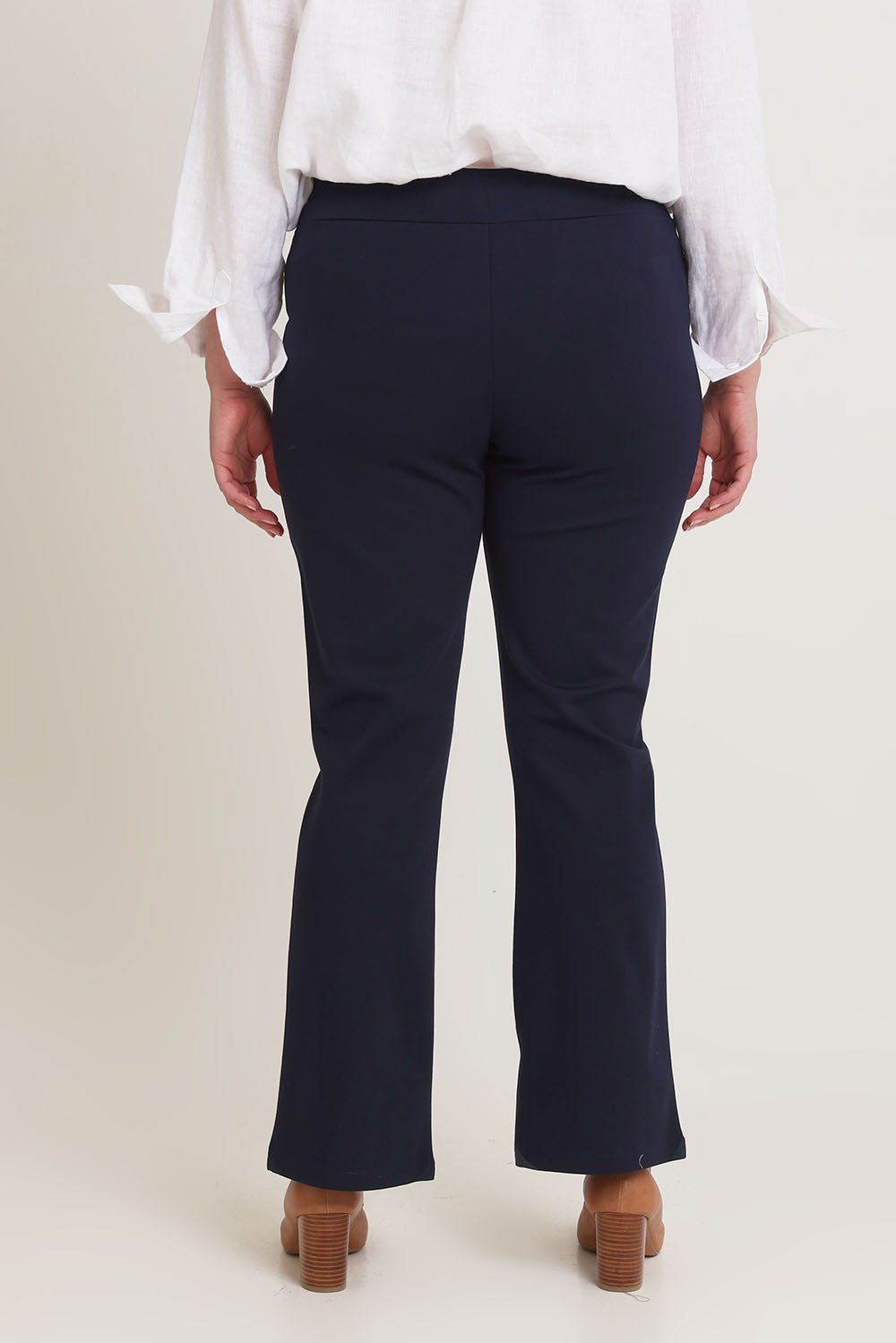 Model Chanel wearing size 16 of The Pull On Ponte Boot Leg Pant in colour Darknavy (Blue), from the back