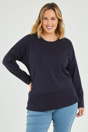 Model Jess wearing size 14 of The Rib Trim Long Sleeve Tee in colour Navy (Blue), from the front, cropped image
