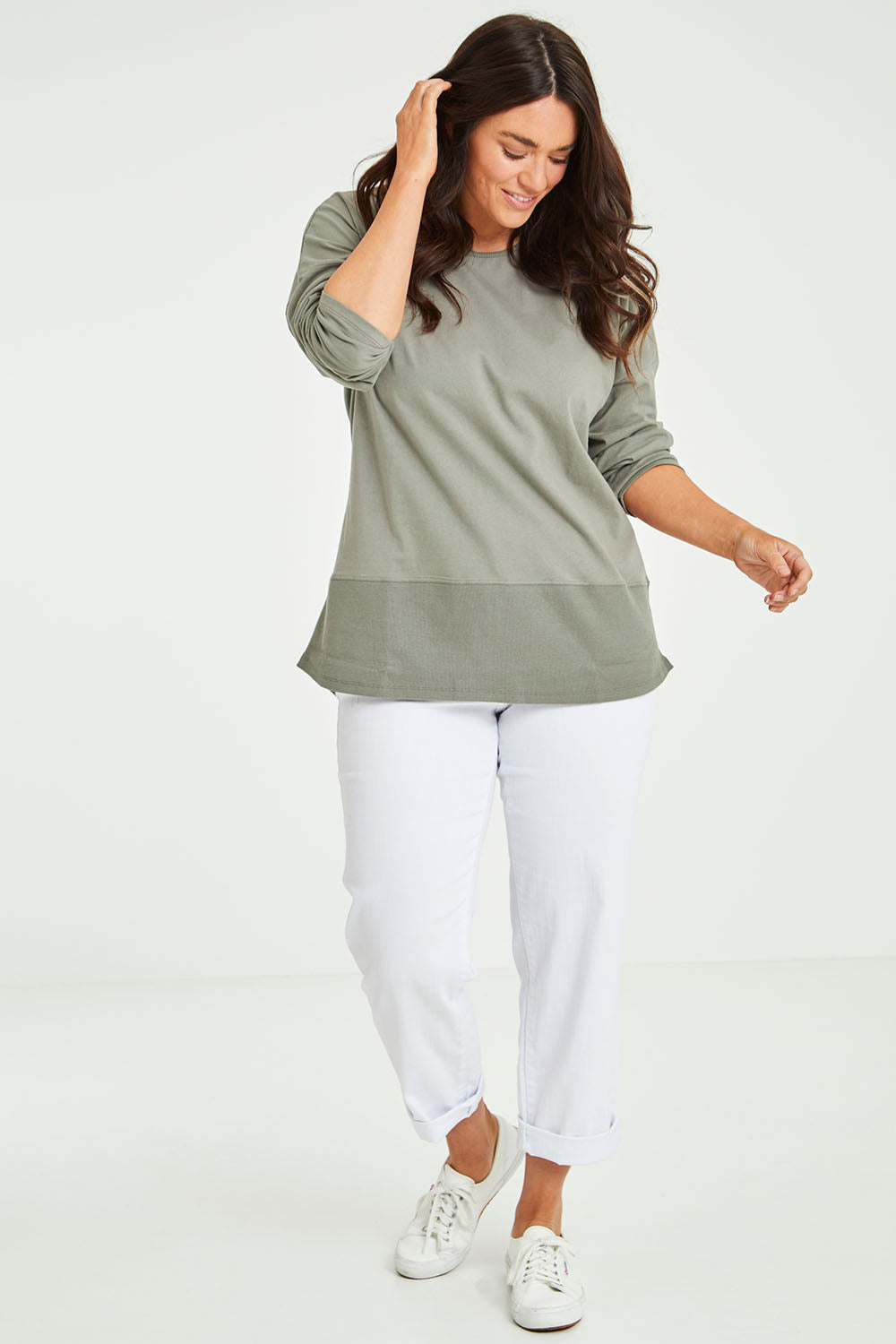 Model Laura wearing size 14 of The Rib Trim Long Sleeve Tee in colour Olive (Green), from the front, showing the whole outfit