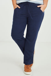 Model Fiona wearing size 16 of The Easy Wear Pant in colour Navy (Blue), from the front, cropped image