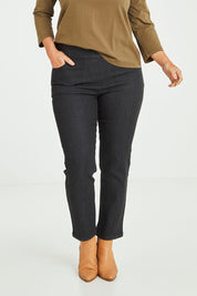 Model Laura wearing size 14 of The 7/8 Pull On Jean in colour Blackdenim (Black), from the front, cropped image