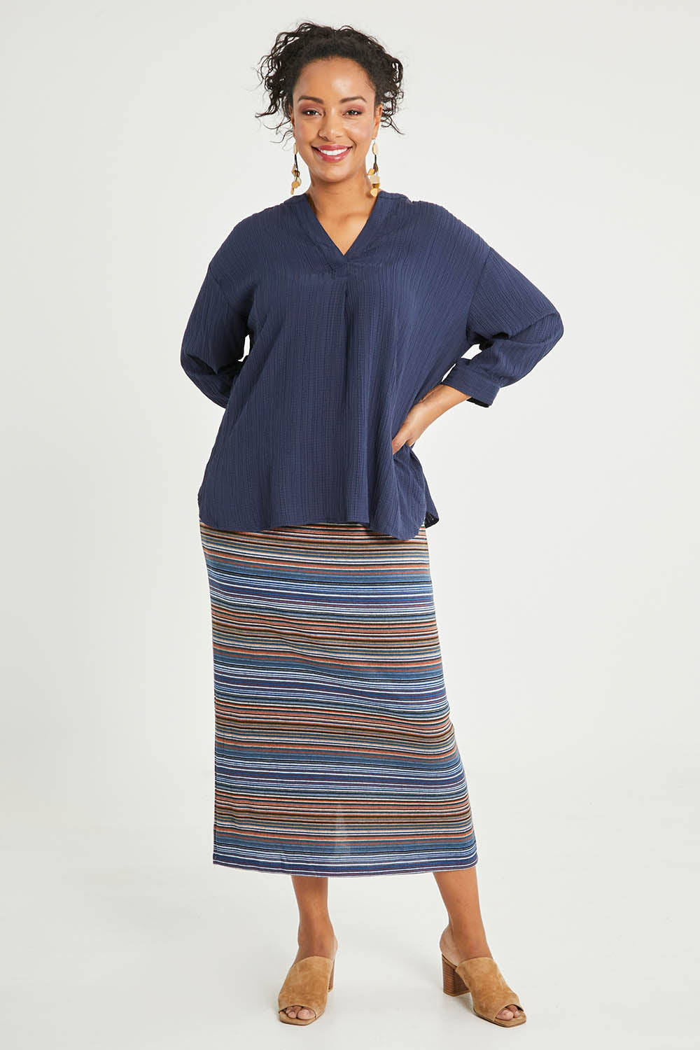Model Noli wearing size 14 of The Striped Light Knit Lined Skirt in colour Bluestripe (Blue), from the front, showing the whole outfit