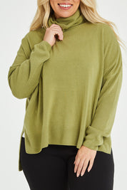 Model Katie wearing size XL of The Essential Soft High Low Jumper in colour Avocado (Green), from the front, cropped image