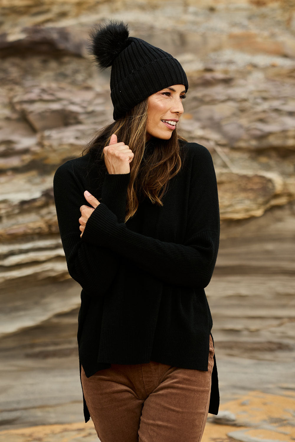 Model Amanda wearing size S of The Essential Soft High Low Jumper in colour Black (Black), from the front, showing the whole outfit