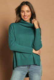 Model Madeline wearing size S of The Essential Soft High Low Jumper in colour Seagreen (Green), from the front, showing the whole outfit