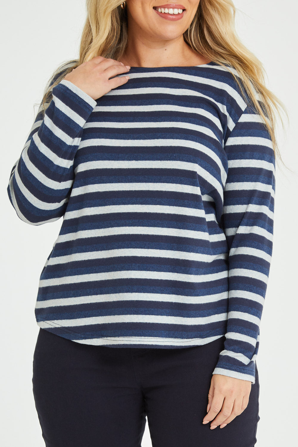 Model Katie wearing size 16 of The Multi Coloured Striped Tee in colour Denim (Blue), from the front, cropped image