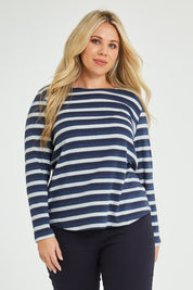 Model Katie wearing size 16 of The Multi Coloured Striped Tee in colour Denim (Blue), from the front, cropped image